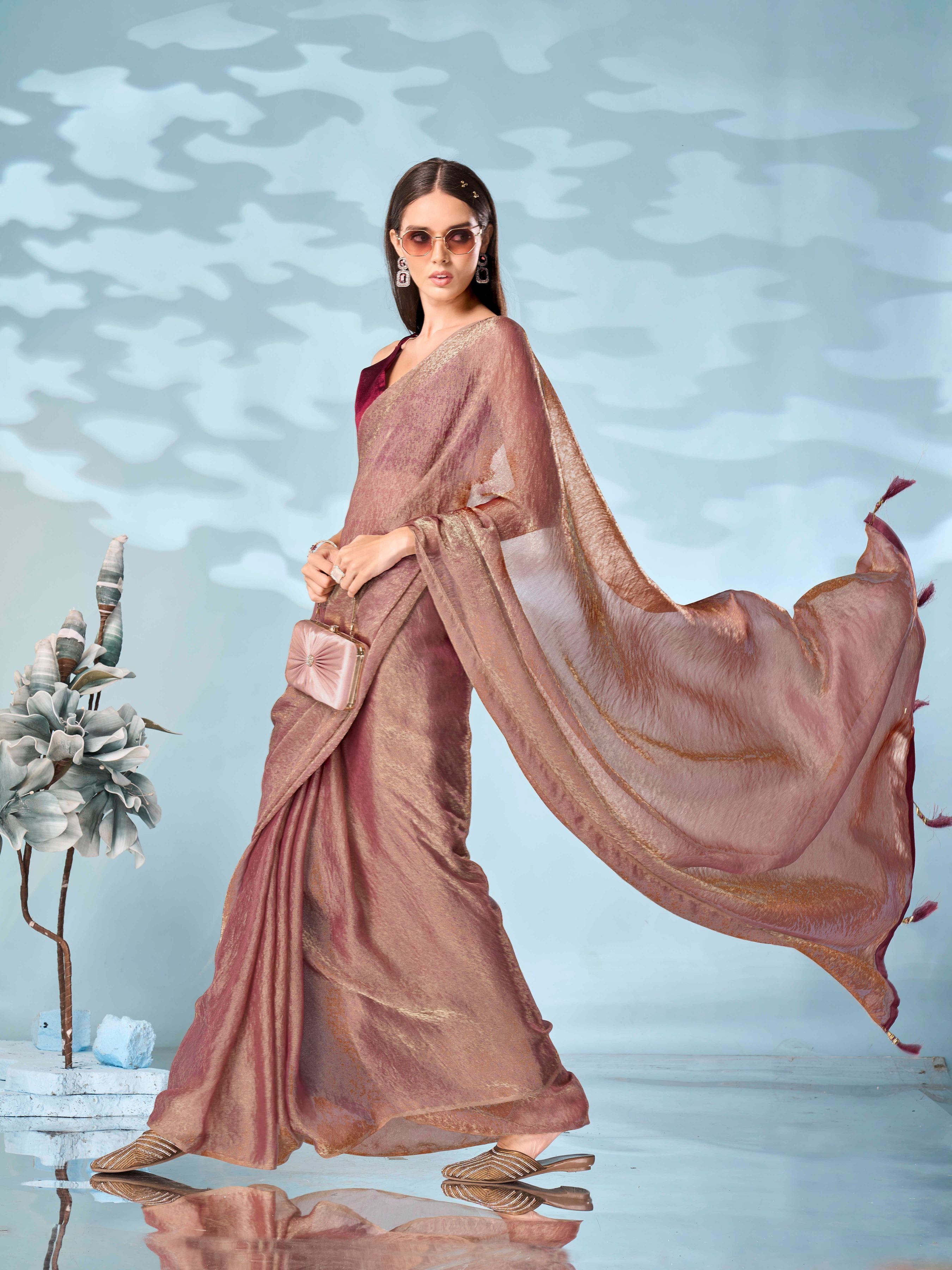 Two tone rose gold and dusty pink colored woven saree with tassles on pallu
